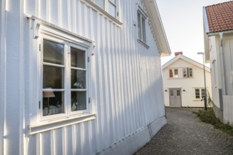 White wooden houses in the alleyways of Smögen, Smögenbryggan, Västra Götalands Län, Bohuslän,