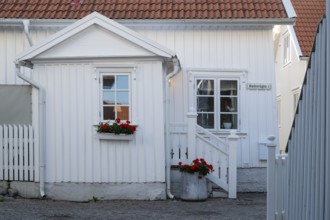 White wooden house in the alleys of Smögen, Smögenbryggan, Västra Götalands Län, Bohuslän, Sweden