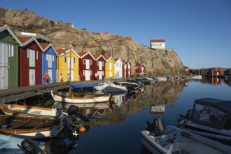 Boats and colourful boathouses in the harbour of Smögen, Smögenbryggan, Västra Götalands Län,