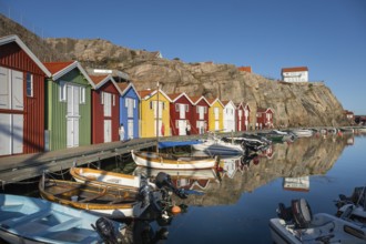 Boats and colourful boathouses in the harbour of Smögen, Smögenbryggan, Västra Götalands Län,