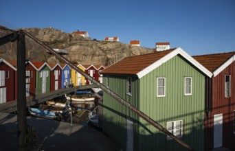 Boats and colourful boathouses in the harbour of Smögen, Smögenbryggan, Västra Götalands Län,