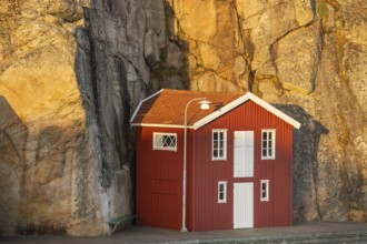 Boathouse between rocks in Smögen harbour, Smögenbryggan, Västra Götalands Län, Bohuslän, Sweden