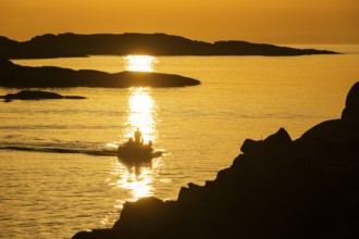 Motorboat between archipelago at sunset, archipelago landscape, Smögen, Smögenbryggan, Västra