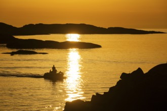 Motorboat between archipelago at sunset, archipelago landscape, Smögen, Smögenbryggan, Västra