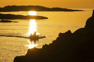 Motorboat between archipelago at sunset, archipelago landscape, Smögen, Smögenbryggan, Västra
