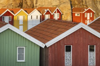 Colourful boathouses between rocks in the harbour of Smögen, Smögenbryggan, Västra Götalands Län,