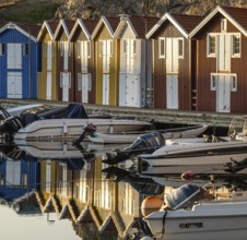 Boats and colourful boathouses in the harbour of Smögen, Smögenbryggan, Västra Götalands Län,
