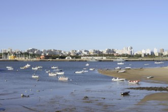 View over the mouth of the river Arade with fishing boats to Portimao, Ferragudo, Algarve, Portugal
