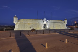 Forte da Ponta da Bandeira fortress by night, Lagos, Algarve, Portugal
