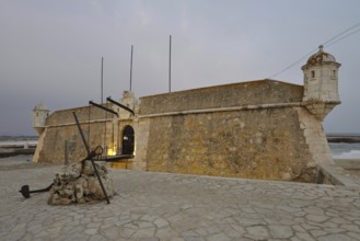 Forte da Ponta da Bandeira fortress at dusk, Lagos, Algarve, Portugal
