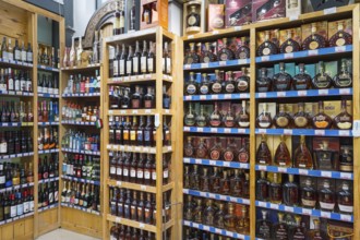 Shelves with various bottles of spirits in a shop, Gntunik supermarket, Aragazotn province, Armenia