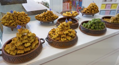 Traditional sweets arranged in decorative bowls in a display, Gntunik supermarket, Aragazotn