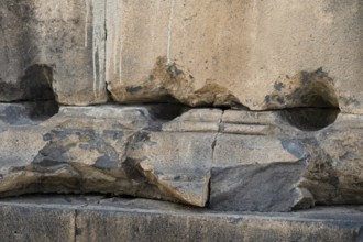 Fragment of a stone wall of an ancient temple made of tufa, Garni, Armenia