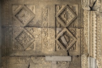 Fragment of the wall of an ancient temple with stucco, Geghard, Armenia