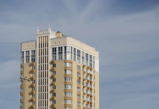 Modern multi-storey building against sky, copy space