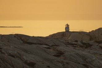 Small lighthouse at sunset, archipelago, Smögen, Smögenbryggan, Västra Götalands Län, Bohuslän,