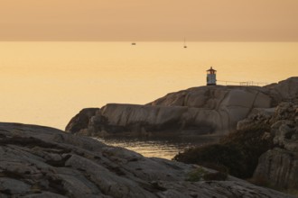 Small lighthouse at sunset, archipelago, Smögen, Smögenbryggan, Västra Götalands Län, Bohuslän,