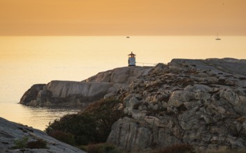Small lighthouse at sunset, archipelago, Smögen, Smögenbryggan, Västra Götalands Län, Bohuslän,