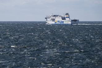 LNG-powered TT-Line ferry travelling across a gently moving blue sea, near Warnemünde, Rostock,