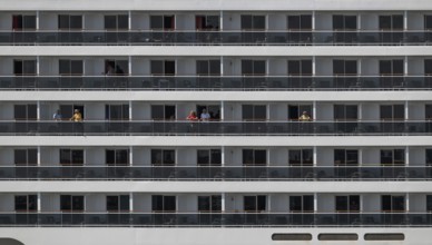 Detailed view of balconies of a cruise ship with passengers, Warnemünde, Rostock,