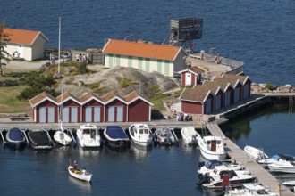 Small harbour with boats, boathouses and lido, Fjällbacka, Bohuslän, West Sweden, Sweden
