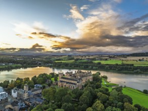 Sunset over Linlithgow Palace from a drone, Linlithgow Loch, West Lothian, Scotland, United Kingdom