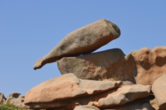 Granite rock in the shape of a bottle on the Cote de Granit Rose coast near Ploumanac'h,