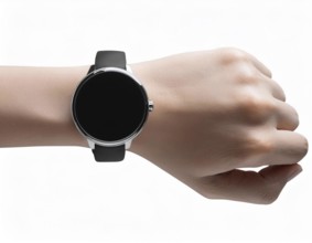 Close-up of a person's wrist wearing a sleek smartwatch with a black strap and blank screen,