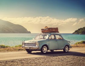 Holiday car luggage on beach, space for text. Summer vacation trip, AI generated
