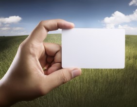 Hand holding a sheet of paper in hand.. AI generated image, ai