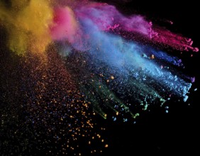 A colorful explosion powder on black background.. Multicolored powder explosion, AI generated