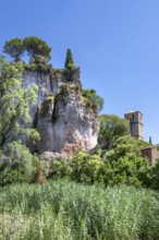 The Romanesque church of Sainte-Marie with its massive bell tower stands embedded in the green of