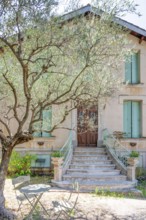 Typical Midi architecture in the south of France: a rustic stone staircase with ornate banisters