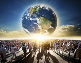A diverse group of people walk toward a glowing depiction of Earth, symbolizing global unity. The