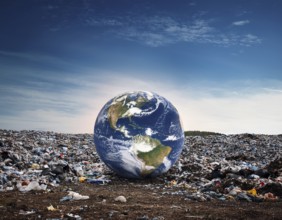 Visually striking scene depicting Earth placed amidst a landfill, illustrating environmental
