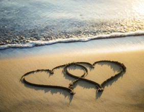 Warm tropical beach with two hearts drawn on the sand, blue waters, and clear skies, invoking