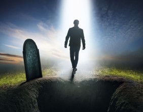 A silhouette of a lone figure walking off a gravestone, The scene evokes Resurrection thoughts