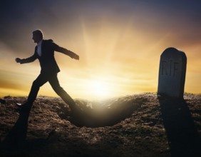 A silhouette of a lone figure walking off a gravestone, The scene evokes Resurrection thoughts