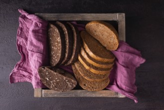 Healthy bread with seeds in a wooden box