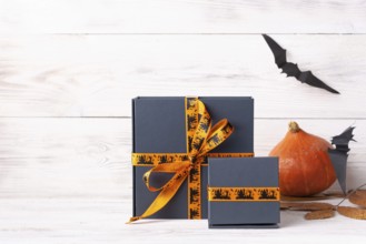 Halloween gifts pumpkin black paper bats copy space