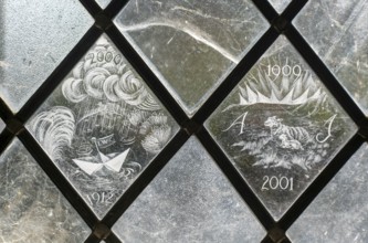 Glass engraved memorial panes, St Mary's church, Alton Barnes, Wiltshire, England, UK designed by