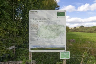 Information notice sign, Modern-day neolithic style long Barrow burial chamber for storing