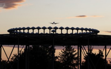 Landing of an aircraft at BER Berlin Brandenburg Willy Brandt Airport, Wullenweber antenna for