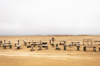 Pink salt displayed on wooden stands along the road to Namib-Naukluft National Park and Sandwich