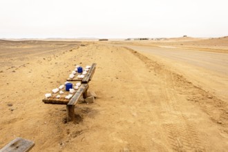 Pink salt displayed on wooden stands along the road to Namib-Naukluft National Park and Sandwich