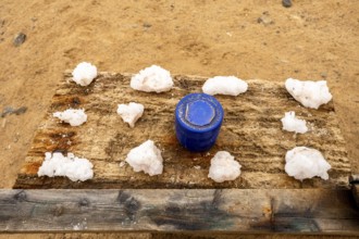 Pink salt displayed on wooden stands along the road to Namib-Naukluft National Park and Sandwich