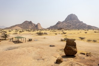 Granite peaks and rugged desert landscape at Spitzkoppe Community Campsite, Namibia. Golden