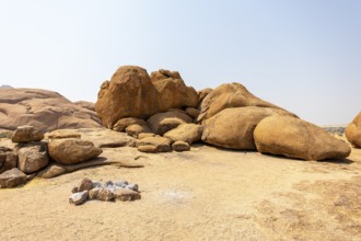 Granite peaks and rugged desert landscape at Spitzkoppe Community Campsite, Namibia. Golden
