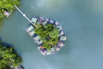 Drone, drone, aerial, from above, topview, topdown, island, lake, settlement, resort, green, blue,