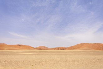 Sossusvlei in Namibia is a desert wonder, famous for its giant red dunes, glowing at sunrise and